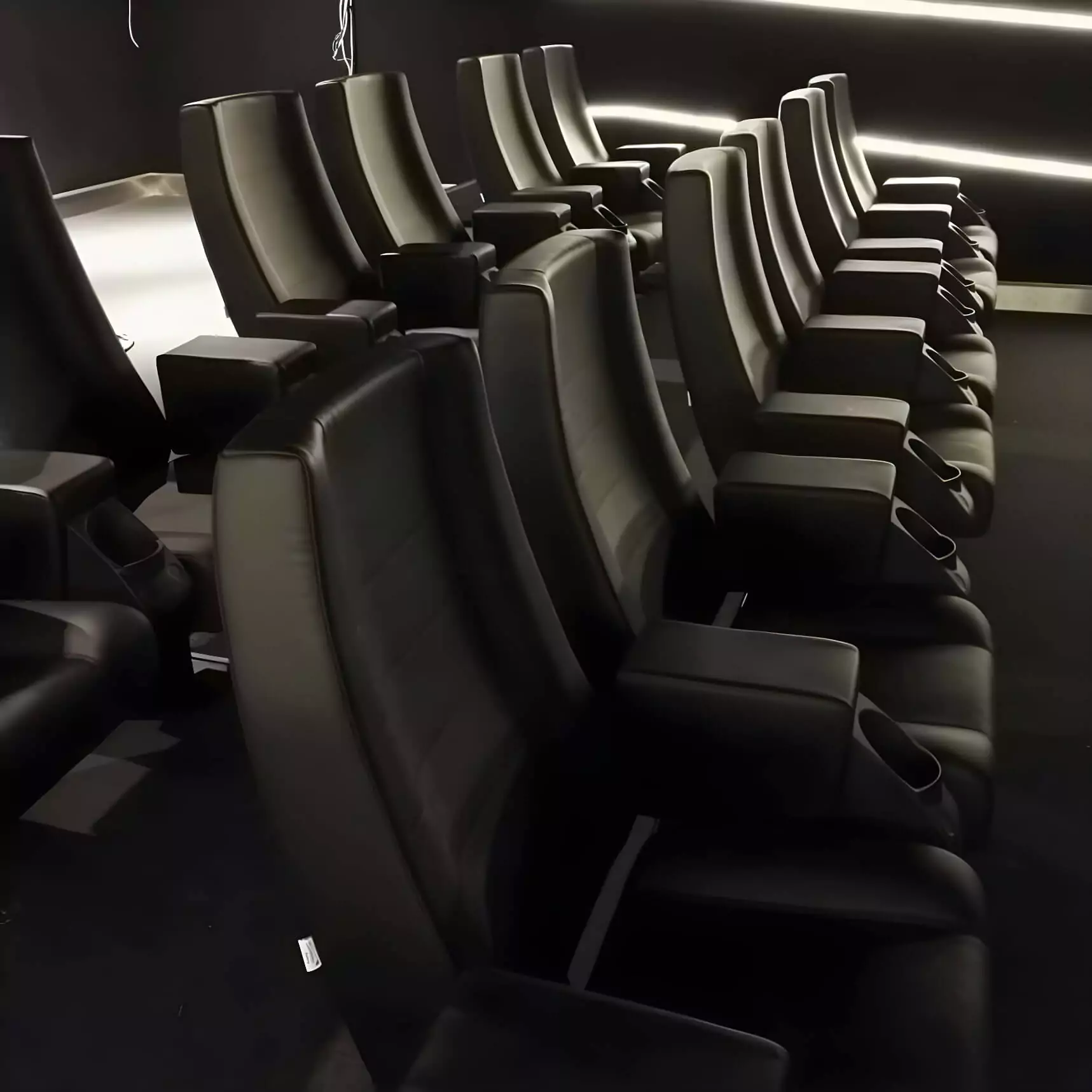 With integrated lighting and reclining features, these theater seats are designed to elevate the cinematic atmosphere. Image